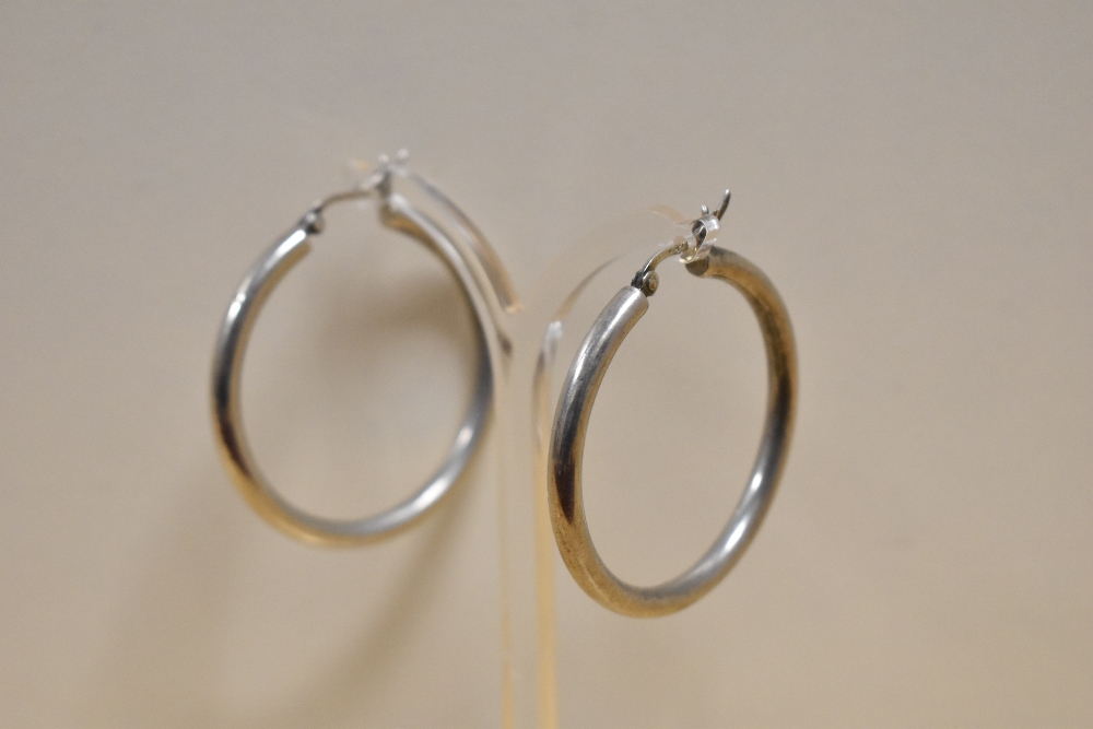 Two pairs of silver earrings comprising a pair of thick rounded hoops and a pair of Art Deco style - Image 4 of 4