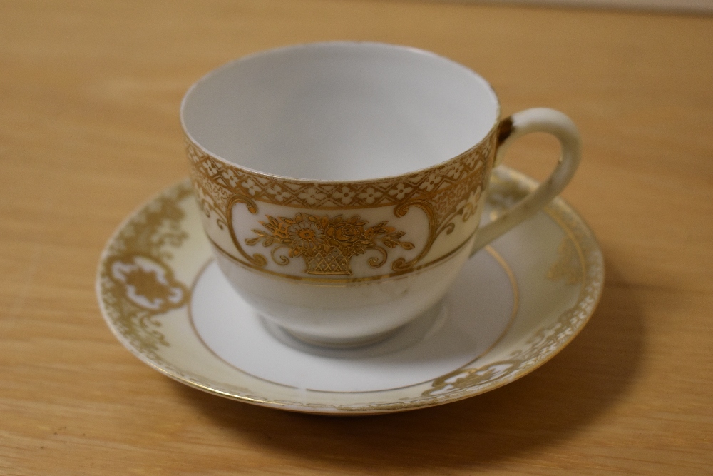 A selection of Noritake table ware, having white ground with gilt relief floral baskets and motifs. - Image 2 of 3