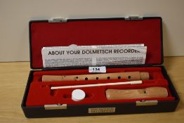 A Dolmetsch natural wood recorder, possibly soprano , length approx. 32cm in fitted case