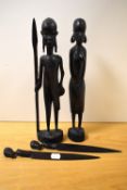 A pair of African tribal carved warrior studies, each measuring 36cm high, and a pair of tribal