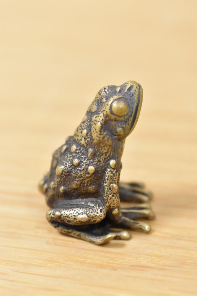 A brass frog, having 'A' impressed to underside.