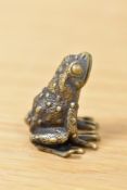 A brass frog, having 'A' impressed to underside.