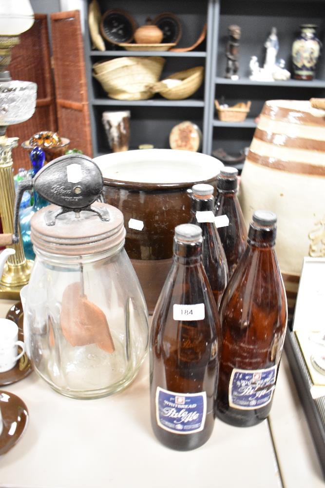 A selection of vintage kitchenalia including butter churn, a large salt glazed crock, and four