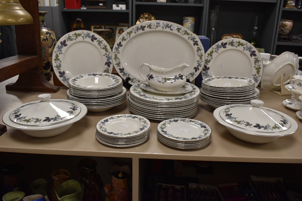 A Royal Doulton 'Burgundy' part dinner service including serving platters, tureens etc. (57 pieces