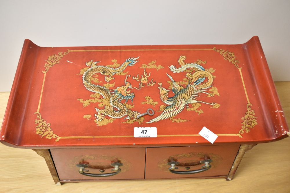 An early to mid-20th Century Chinese red lacquered cabinet, having two drawers, and measuring 33cm x - Image 2 of 2