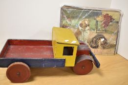 A cute vintage wooden jigsaw of pets and a large wooden toy truck.