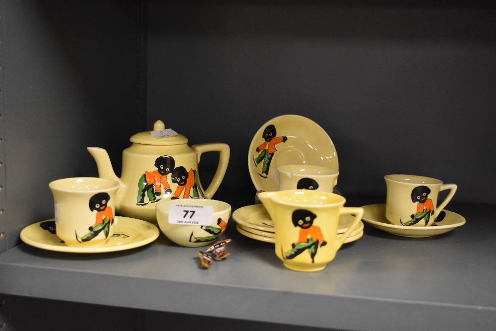 A mid-20th Century Carlton ware tea set, hand decorated with jolly men against a yellow ground, plus