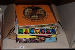 A selection of vintage record albums including George Formby, Max Boyce and the Goon Show etc.