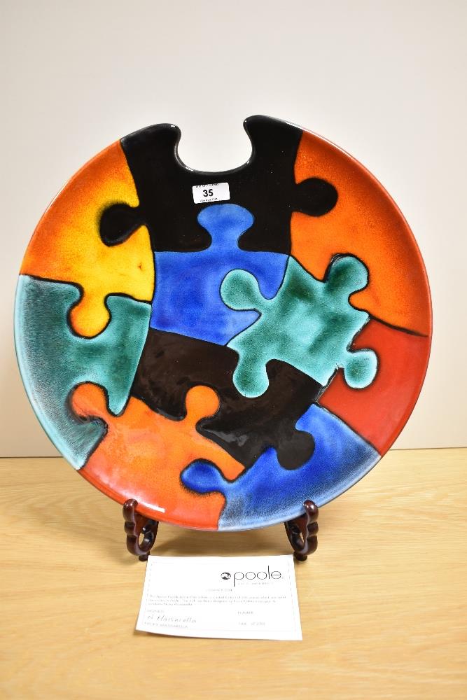 A 20th Century Poole pottery charger, of Jigsaw Puzzle design, a limited edition 144 of 250,