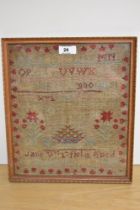 A Victorian needlework alphabet sampler, stitched by Jane Reed, framed and under glass, measuring