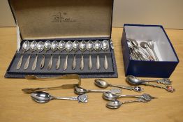 A boxed set of 12 Zilfa Pleet, Zilverfabriek teaspoons, a small amount of display spoons and a brass