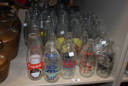 39 vintage glass advertising milk bottles.