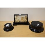 An Oriental cork diarama in ebonised case sold along with two ebonised dome bases.