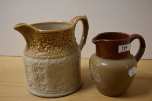 An early 20th Century Cadbury stoneware jug, measuring 15cm high, and another relief moulded