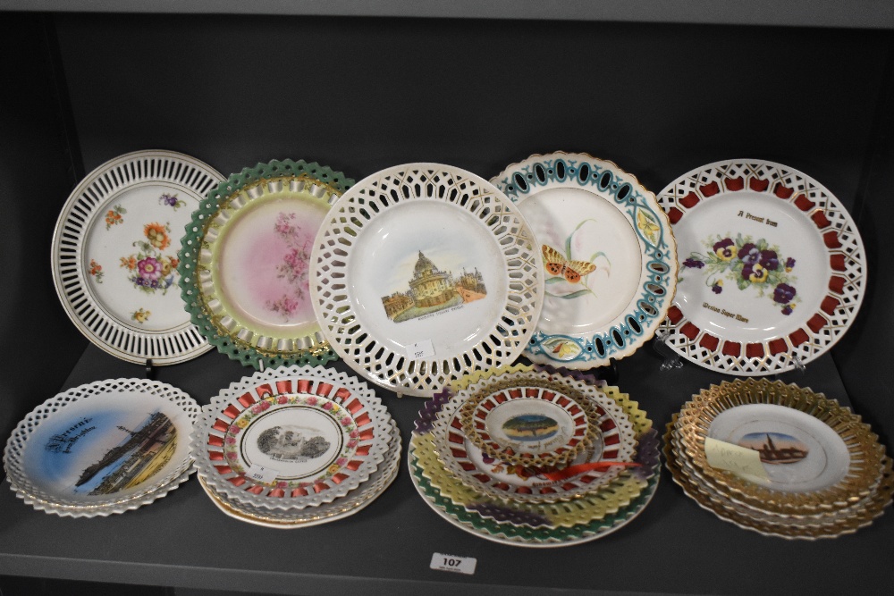 An assorted group of 19th/20th Century porcelain ribbon edged plates depicting city scenes and still