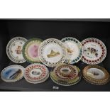 An assorted group of 19th/20th Century porcelain ribbon edged plates depicting city scenes and still