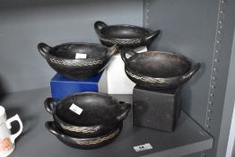 Five Hellenistic style wooden bowls of varying sizes, the largest having a diameter of 14cm