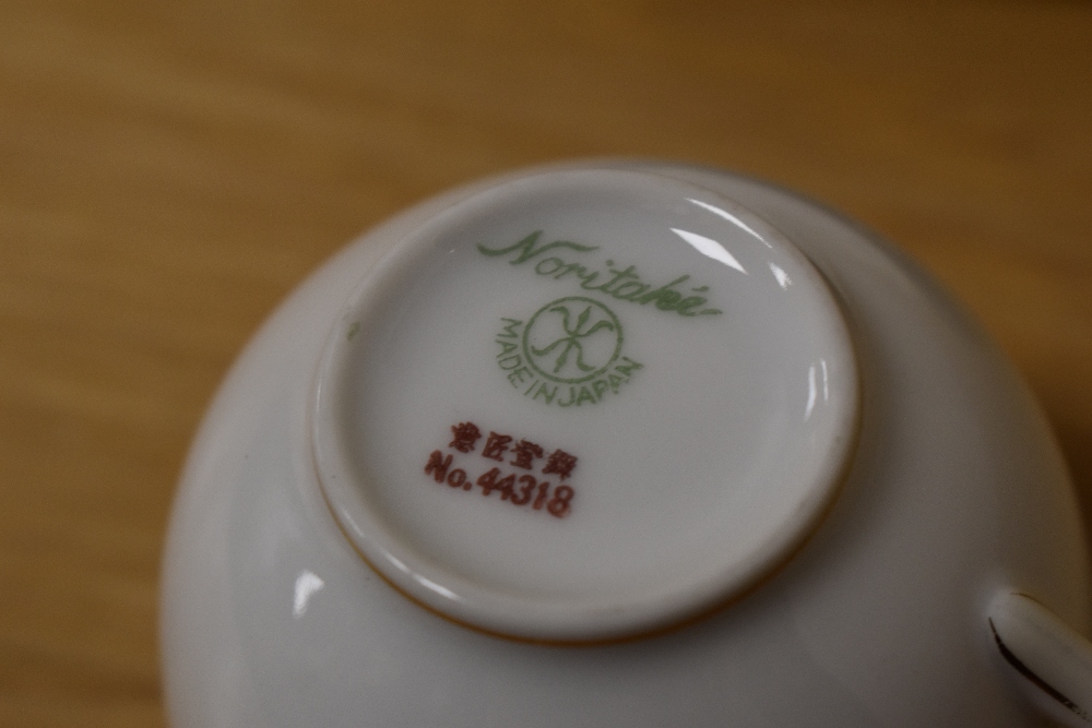 A selection of Noritake table ware, having white ground with gilt relief floral baskets and motifs. - Image 3 of 3