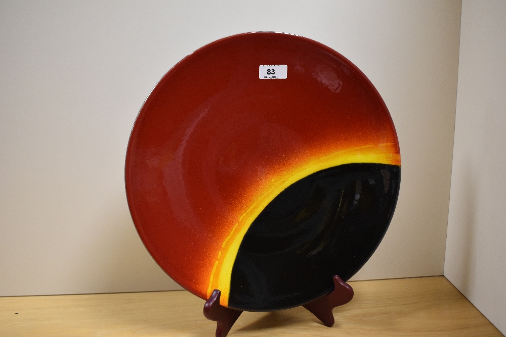A 20th Century Poole pottery charger, in the 'Eclipse' design, measuring 35cm in diameter