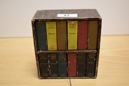 A novelty Dennisons office supply tidy, in the form of a bookcase with books, dimensions 12cm x 14cm