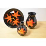 Two 20th Century Poole pottery vases and dish, in the Forest Flame pattern, the largest vase