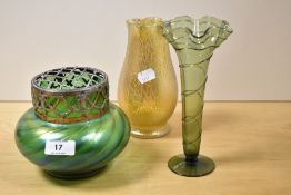 An Art Nouveau iridescent green glass rose bowl , a similar vase and a green fluted glass vase