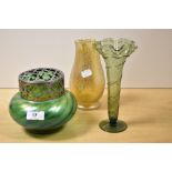 An Art Nouveau iridescent green glass rose bowl , a similar vase and a green fluted glass vase