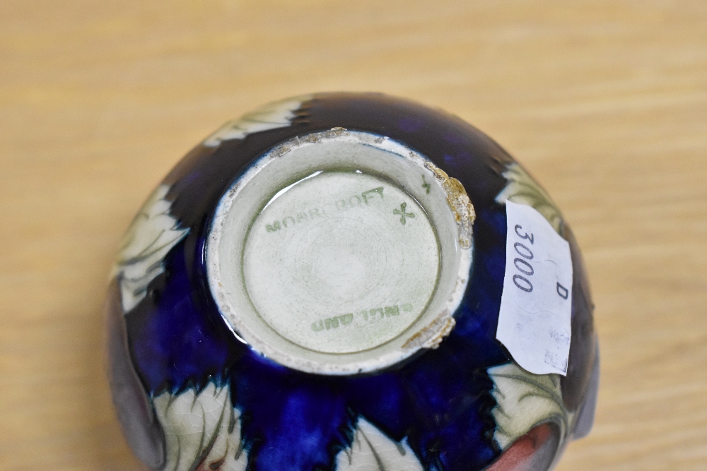A William Moorcroft squat vase, in the Pansy pattern against a blue ground, measuring 6.5cm tall - Image 3 of 3