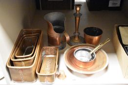 A graduated set of four rectangular copper planters, a dry goods scoop, and two small copper pans