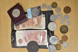 An assortment of coins and banknotes including Festival of Britain coin and Ten Shilling banknote