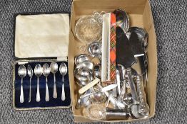 A boxed set of six plated teaspoons and a small carton of assorted flatware and cutlery etc.