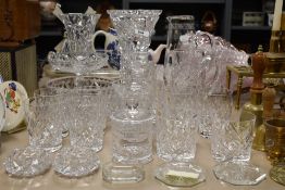 A nice selection of cut glass pieces including whiskey glasses, decanter, large vases and tazza etc.
