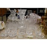 A nice selection of cut glass pieces including whiskey glasses, decanter, large vases and tazza etc.