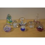 Seven assorted paperweights and a similar scent bottle including Karl Ittig 2015, Caithness and