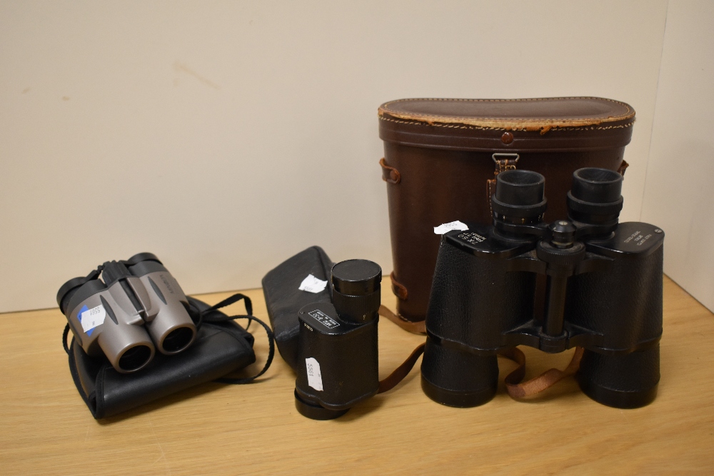 A pair of vintage 7x50 field binoculars with leather case, a pair of Minolta Compact II 10x25