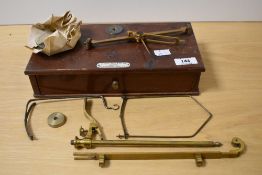 A cased set of brass scientific weighing scales