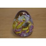 A Whitefriars paperweight by Ray Annenberg in Millefiori yellow, pink and white swirls, Catalogue N