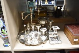 Two pairs of short silver plated candlesticks, a triple branch candelabra, a cruet stand and a