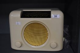 A 1950s Bush DAC bakelite radio, measuring 23cm x 33cm x 18cm