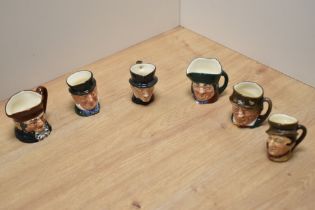 A group of six miniature Royal Doulton bone china character jugs, comprising John Peel, Paddy, Sam