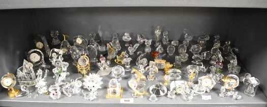 A large quantity of Swarovski crystal ornaments, various to include state carriage, globe clock,