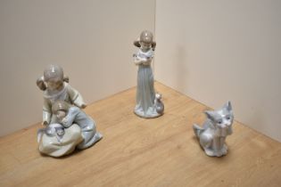 A group of three Lladro porcelain cat related figures, comprising Little Sister 1534, Don't Forget