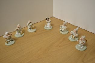 A collection of seven Lenox, Disney Showcase miniature Snow White and The Seven Dwarfs figures,