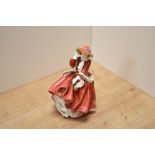 A Royal Doulton bone china figurine Top o'the Hill figurine, HN1834, windswept female in red dress