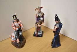 A group of three Royal Doulton bone china figures, comprising The Wizard HN2877, Drummer Boy