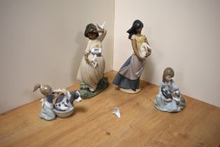 Two Lladro porcelain figure groups comprising 'Bashful Bather' number 5455, and 'Cat Nap' 5640, sold