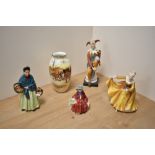 A group of three Royal Doulton bone china figurines, comprising The Orange Lady HN1953, Linda