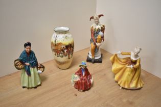 A group of three Royal Doulton bone china figurines, comprising The Orange Lady HN1953, Linda
