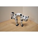 A Lorna Bailey hand-painted limited edition pottery stylised cat figure, modelled with arched back