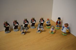 A group of eleven collectible Wade porcelain figures, comprising five 'Newark 1998' travelling